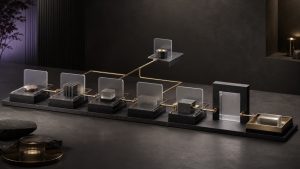 Premium editorial modular workflow stations connected by brass rails with a review gate and final handoff tray